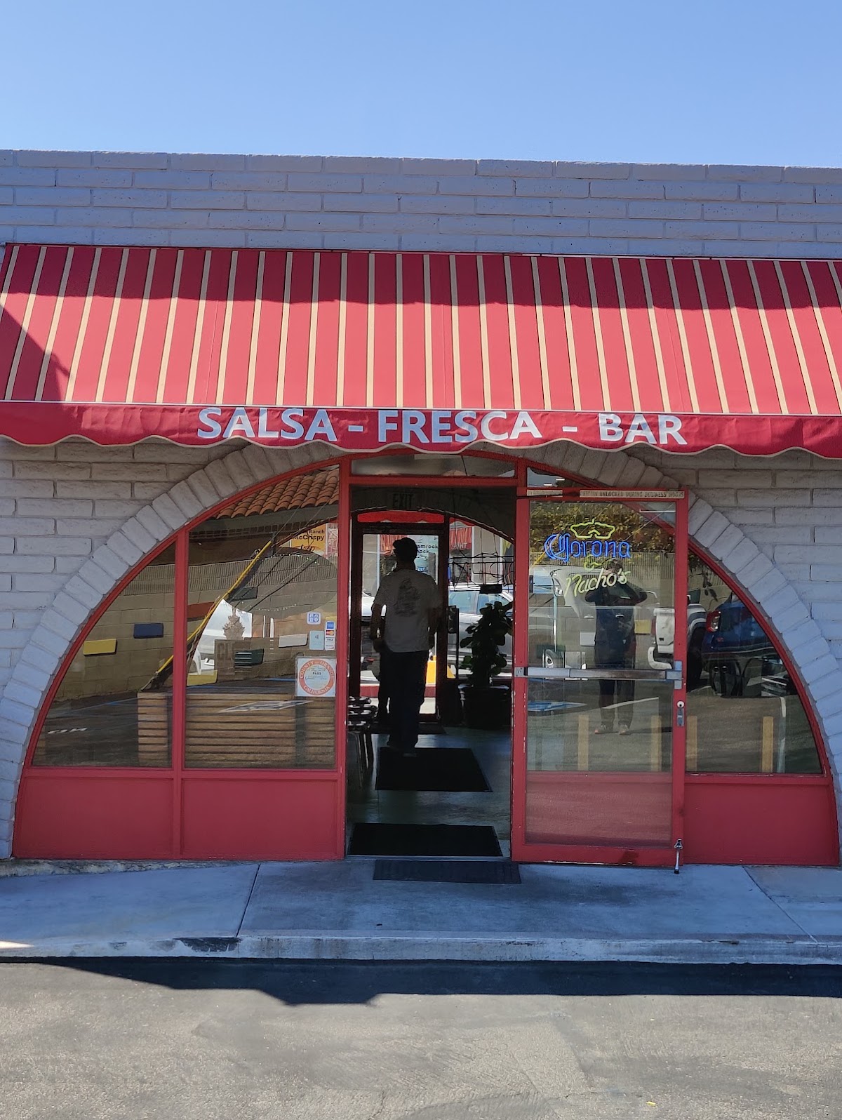 The red-fronted entrance of George's Mexican Food on Edinger Avenue